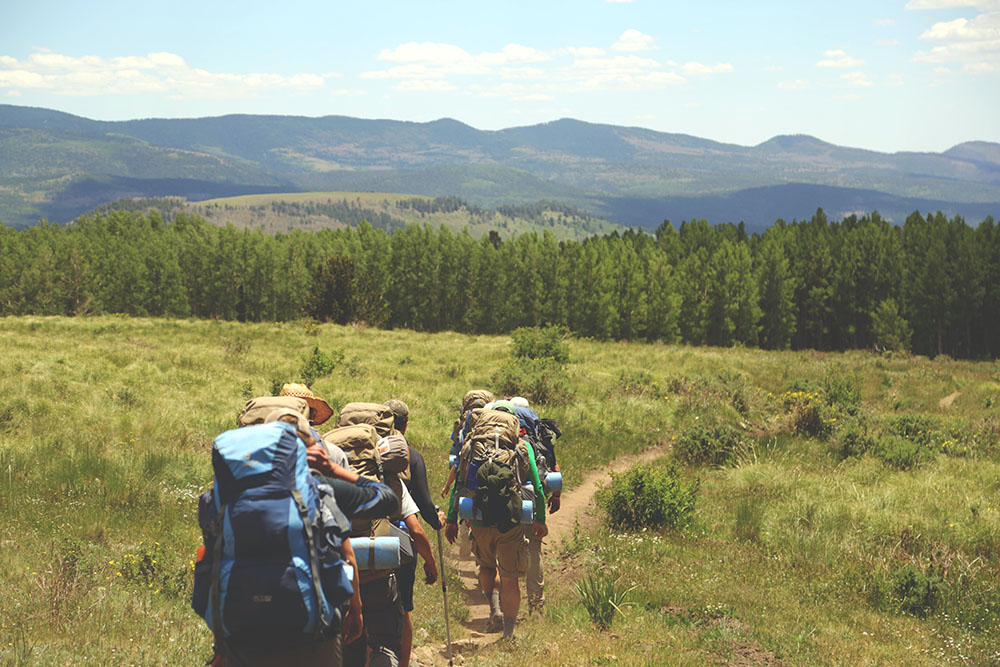 backpackers in a field